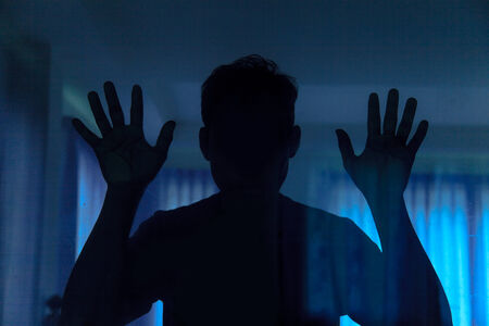 Shadow of men behind glassの写真素材