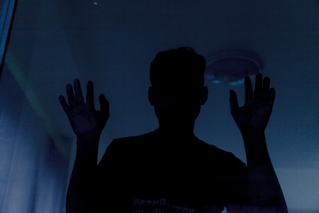 Shadow of men behind glassの写真素材