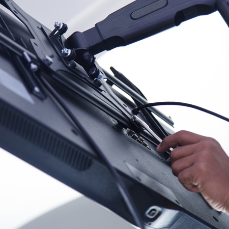 Installing mount TV on the wall at home or officeの写真素材