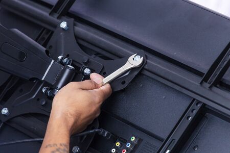 Installing mount TV on the wall at home or officeの写真素材