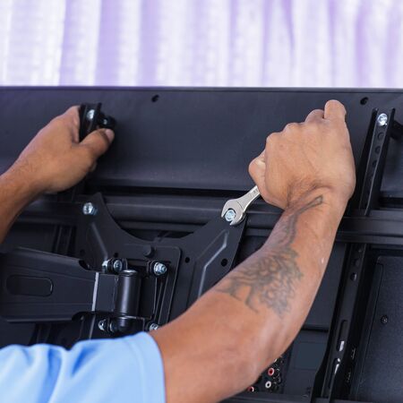 Installing mount TV on the wall at home or officeの写真素材