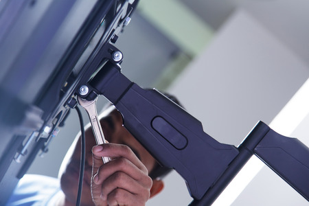 Installing mount TV on the wall at home or officeの写真素材