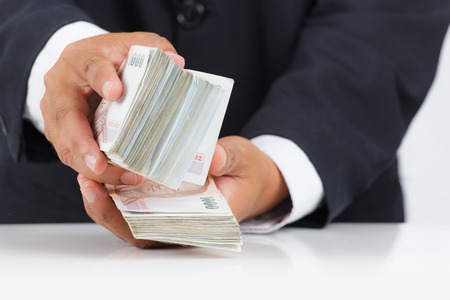 Businessman with huge amount of moneyの写真素材