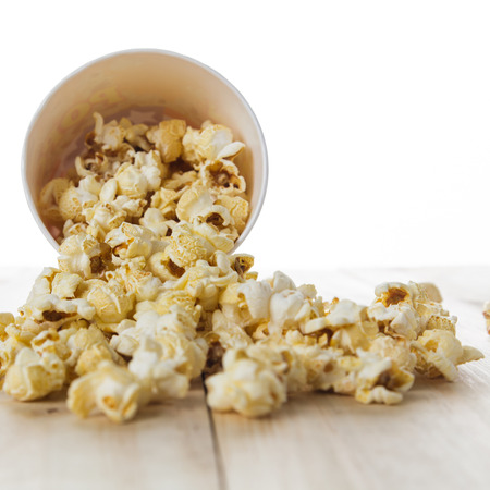 Popcorn on a wooden tableの写真素材