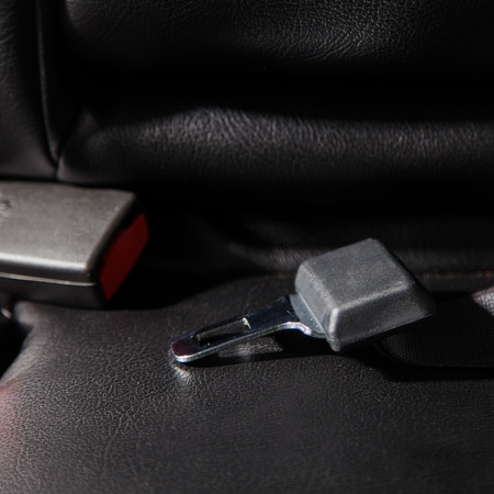 Seat belt on a black leather
