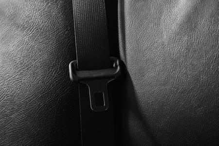 Seat belt on a black leatherの写真素材
