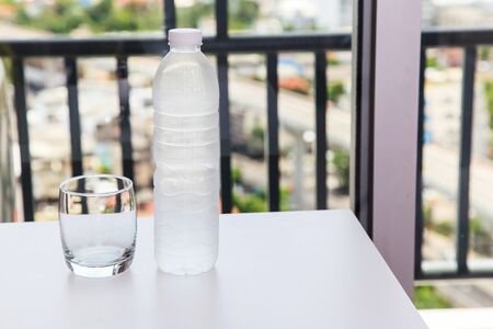 Glass of water and bottle in the houseの写真素材