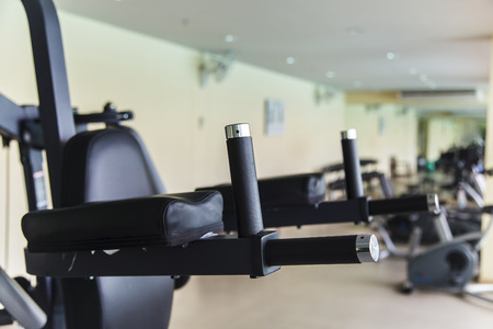 Empty fitness center with different training equipment