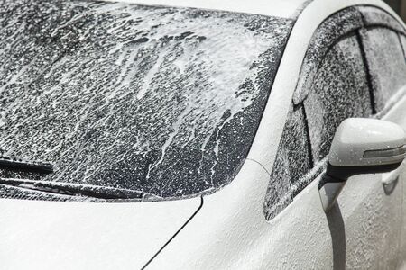 Washing a car at car wash serviceの写真素材