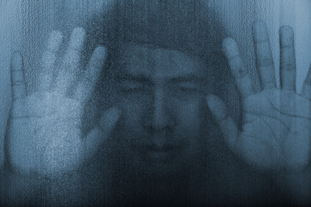 The shadow of the men behind the glassの写真素材