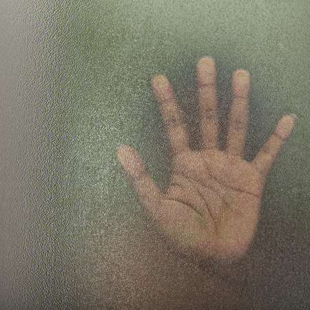 The shadow of the men behind the glassの写真素材