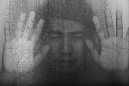 The shadow of the men behind the glassの写真素材