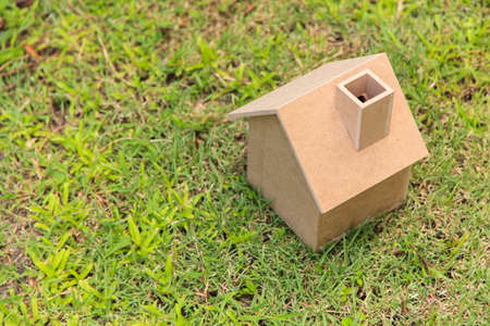 Wooden house on green grassの写真素材