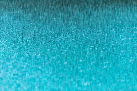 Rain water drop falling to the floor in rainy seasonの写真素材