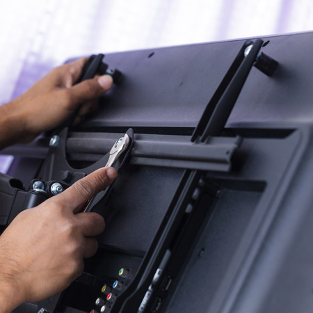 Installing mount TV on the wall at home or officeの写真素材