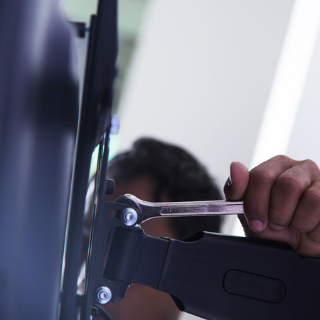 Installing mount TV on the wall at home or officeの写真素材