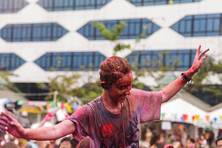 BANGKOK, THAILAND - March 2016: Unidentified People celebrating during the color throw at the Holi...