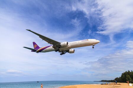 PHUKET, THAILAND - December 2015 : Thai airways airplane Landing at Phuket International airport in sunny day on December 25, 2015 in Phuket, Thailand.のeditorial素材