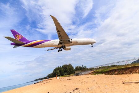 PHUKET, THAILAND - December 2015 : Thai airways airplane Landing at Phuket International airport in sunny day on December 25, 2015 in Phuket, Thailand.のeditorial素材