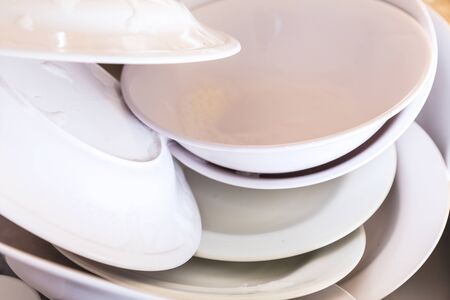 Dirty Plates and dishes in the sinkの写真素材