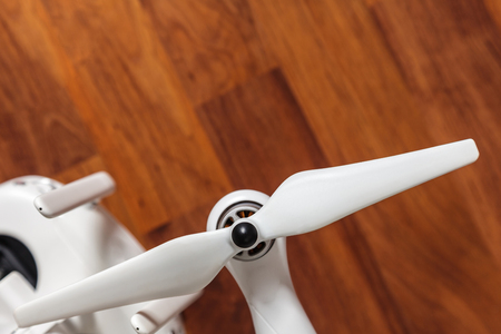 White Drone on wooden backgroundの写真素材