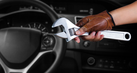 Cropped view of Hand with wrench, Auto mechanicの写真素材