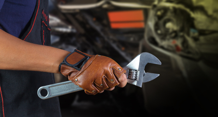Cropped view of Hand with wrench, Auto mechanicの写真素材