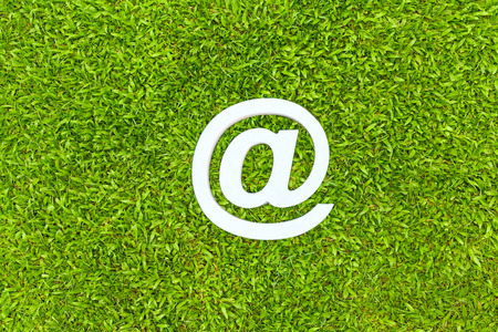 Email sign on green grass under the blue skyの写真素材