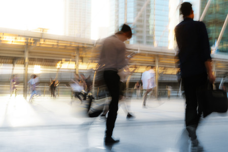 People walking in motion blur in the city