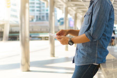 Man use of tablet computer in the city の写真素材