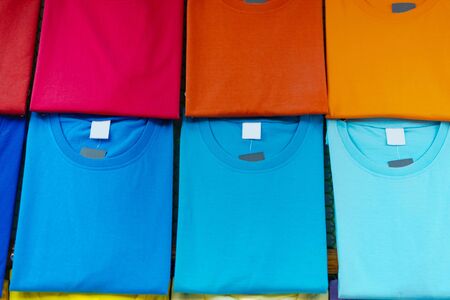 Close up of Colorful t-shirts on hangersの写真素材