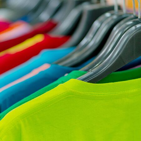Close up of Colorful t-shirts on hangersの写真素材