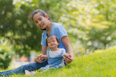 Lifestyle Family, Happy mom and daughter enjoying time in the parkの写真素材