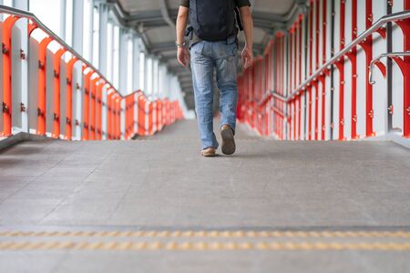 Asian man walking in the city