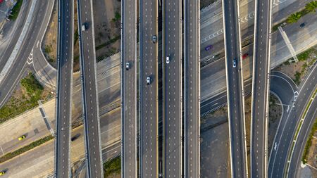 Aerial top view of highway, Transport city junction road with car on Intersection cross road shot by droneの写真素材