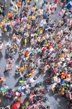 BANGKOK, THAILAND - APRIL 14: Unidentified Thai and International people enjoy in "Bangkok Songkran Festival 2019 (Thailand new year)" at Silom Road on April 14, 2019 in Bangkok, Thailandのeditorial素材