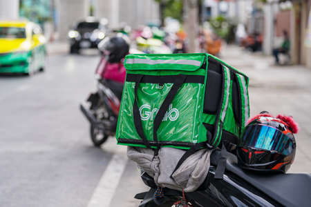 Bangkok, Thailand - June 7, 2020 : Motorbike at the street, Food delivery service through its app Grabfoodのeditorial素材