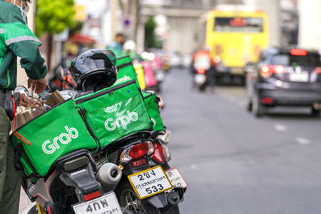 Bangkok, Thailand - June 7, 2020 : Motorbike at the street, Food delivery service through its app...