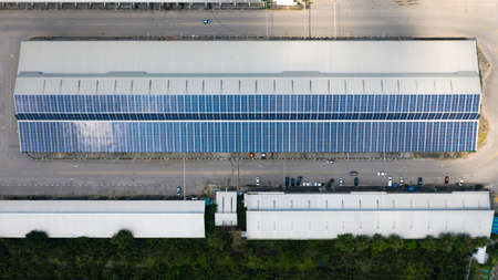 Aerial top view of the solar cells on the roof, Solar panels installed on a roof of a large...