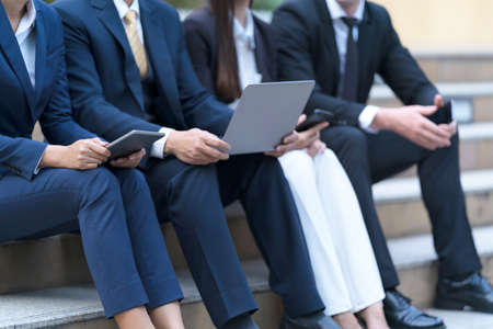 New normal, Virus Situation in Business Concept, A group of four business people working in front of modern officeの写真素材