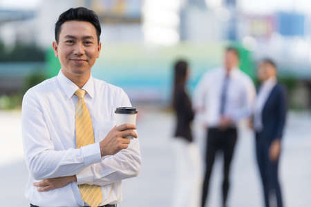 Business people standing and talk to each other in front of modern office, Team work concept, Business success win resultの写真素材