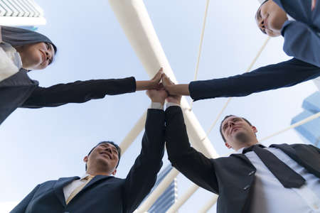Business people standing and talk to each other in front of modern office, Team work concept,...