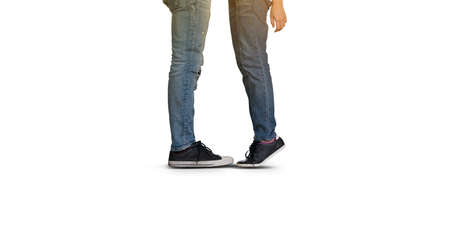 Couple kissing, girls stands on tiptoe to kiss her man on white backgroundの写真素材