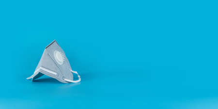 Hygienic face mask on blue backgroundの写真素材