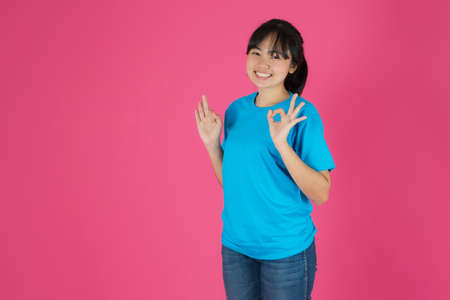 Asian woman working with calculator, Selling online ideas concept, Online seller business shop at homeの写真素材