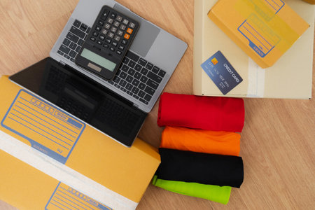 Asian woman working with calculator, Selling online ideas concept, Online seller business shop at homeの写真素材