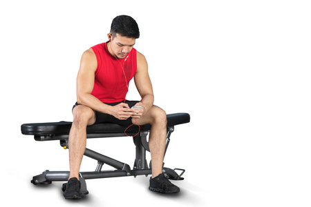 Close-up of fitness man, Handsome athletic guy workout with dumbbellsの写真素材