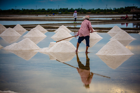 a salt farmer working in a salt farmの写真素材