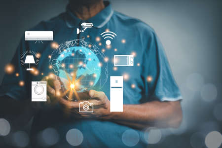 Users are using laptops to connect to devices and applications. Through the Internet technology, shopping, data management, finance and banking. Concept Internet of things, Iotの写真素材