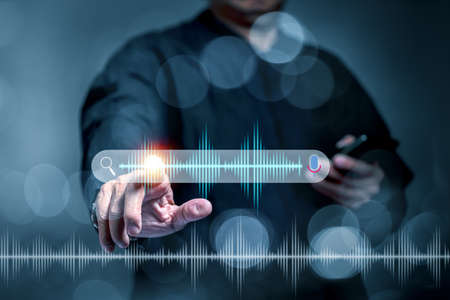 Businessmen use search engines in smartphones. To search for information by voice instead of using...